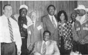 Standing left to right: Brian Sullivan, Leonard Hines and Duncan Guild (Country Club Hills PD), Sen. William Shaw (D-15), Sandra Duffin, Curtis Harris and Sherman Williams (Country Club Hills PD); Seated: Sen. Emil Jones, Jr. (D-14)