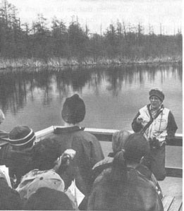 Stacy Miller, the interpreter of Volo Bog State Natural Area, tells the story of the bog man to fifth 
graders from a nearby school.