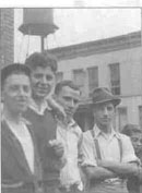 Men gathered on their block