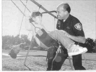 Officer Bill Roscop and young friend